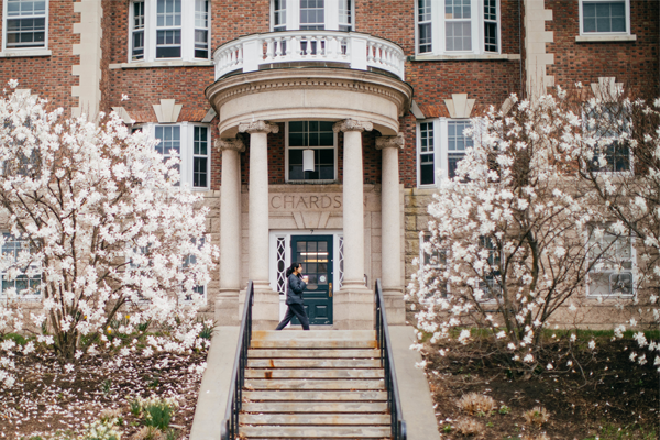 Entrance of Richardson Hall with flowering trees out front