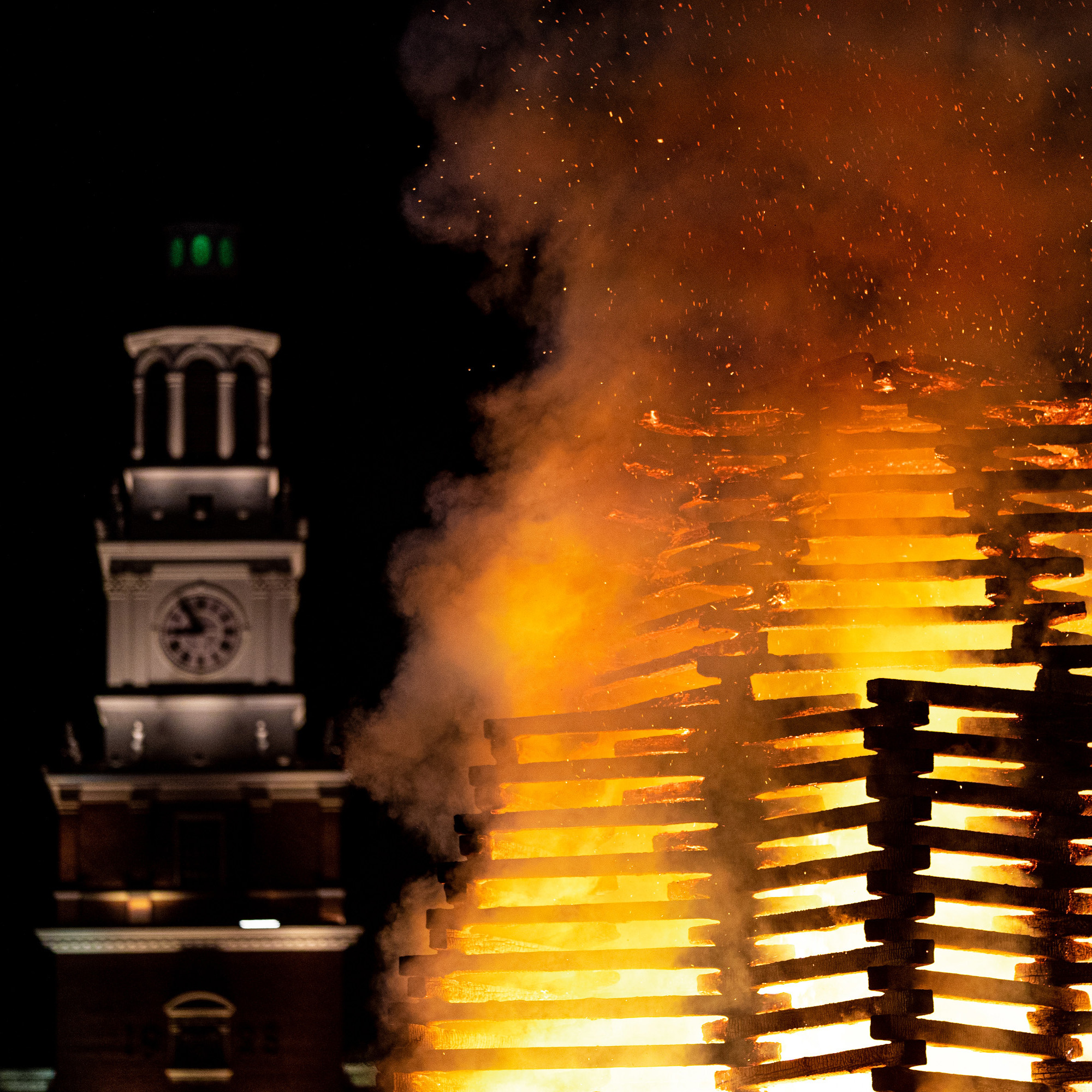the Homecoming bonfire with Baker Tower in the background