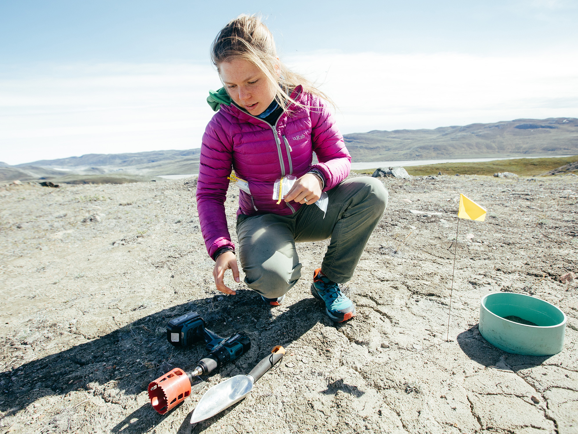 a woman chooses a tool during a research project in Greenland