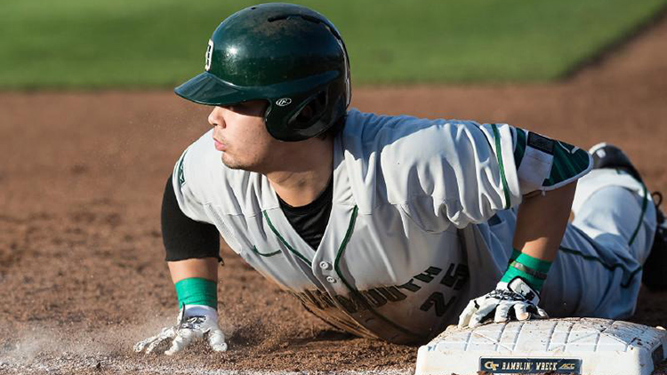 Dartmouth baseball player slides headfirst back into first base after a pick-off move