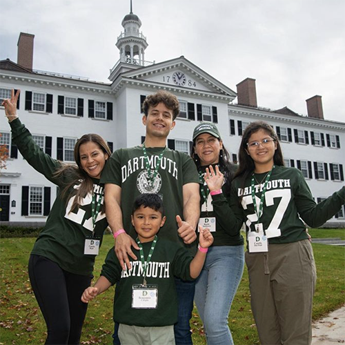 The family of a Dartmouth ’27 poses in front of Dartmouth Hall with every member of the family in Dartmouth shirts