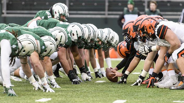Dartmouth football team lines up on defense against an opponent's offense