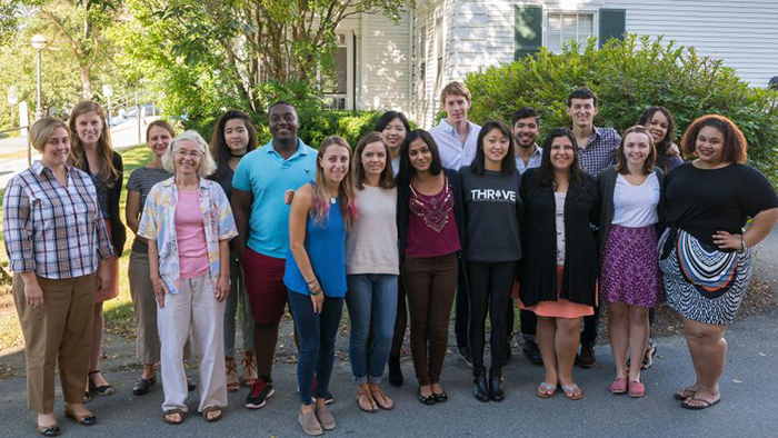The Dartmouth Social Impact team stands outside for a group photo on campus
