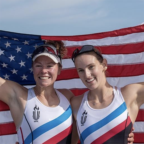 Two female Dartmouth alums raise the American flag after qualifying for the Paris Olympics in rowing