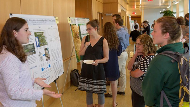 A student presents research at the Wetterhahn Science Symposium