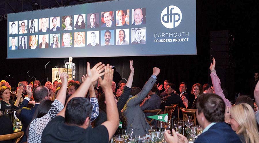 A group of people cheering at a Dartmouth Founders Project event