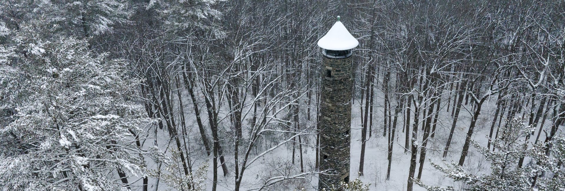 Aerial shot of Bartlett Tower covered in snow
