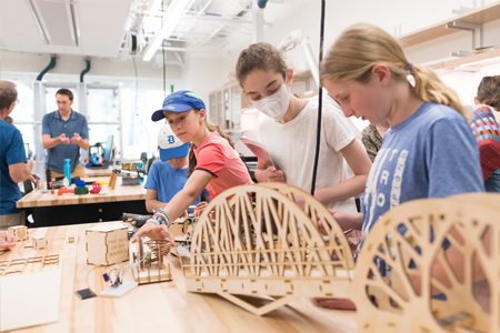 Children building bridges in tabletop activity