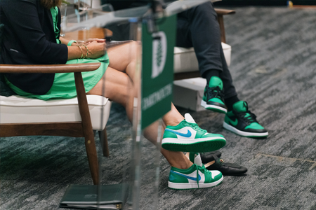 Green Nike sneakers on President Beilock