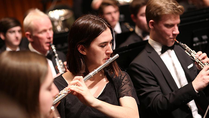 The Dartmouth Wind Ensemble performs on stage at Dartmouth