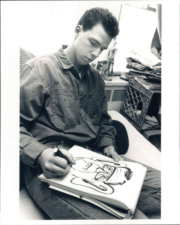 Jake Tapper ’91 H’17 drawing a cartoon during his time at Dartmouth.