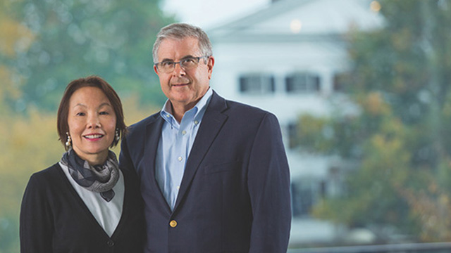 Patty Chan and Howard Hodel stand in front of Dartmouth Hall