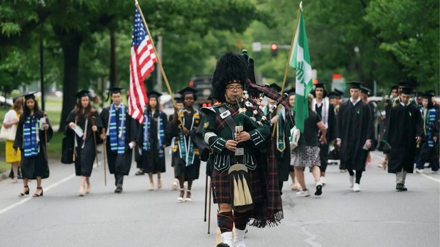 Dartmouth bagpiper leading commencement procession. 