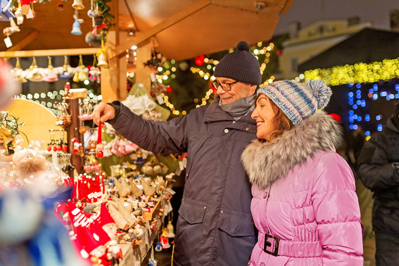 couple buying goods at a holiday market
