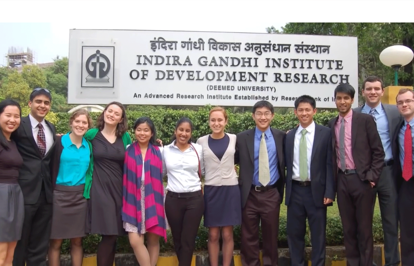Students posing in front the Indira Gandhi Institute sign while studying abroad