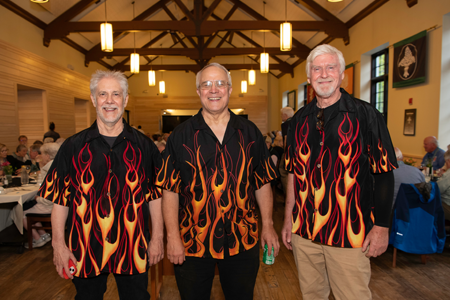 Three alums in flames T-shirts at Reunions 2024