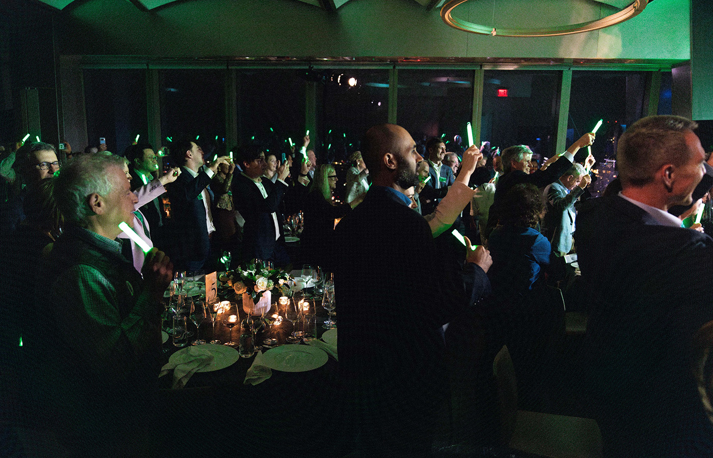 A group of people standing and celebrating at the Entrepreneurs Hall of Fame event 