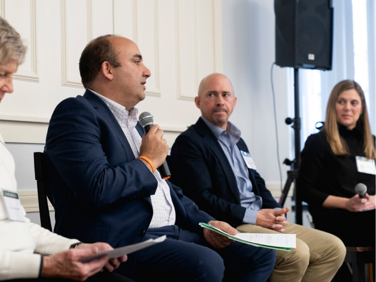 A group of Dartmouth alumni panelists, seated and speaking at the Future of Work in Education event. 