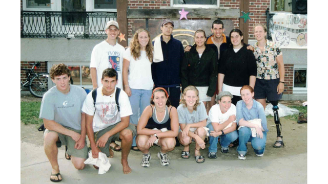 A group of trippies from the Class of 2003 posing in front of Robinson Hall.