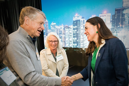 President Beilock shaking the hand of an alum, smiling