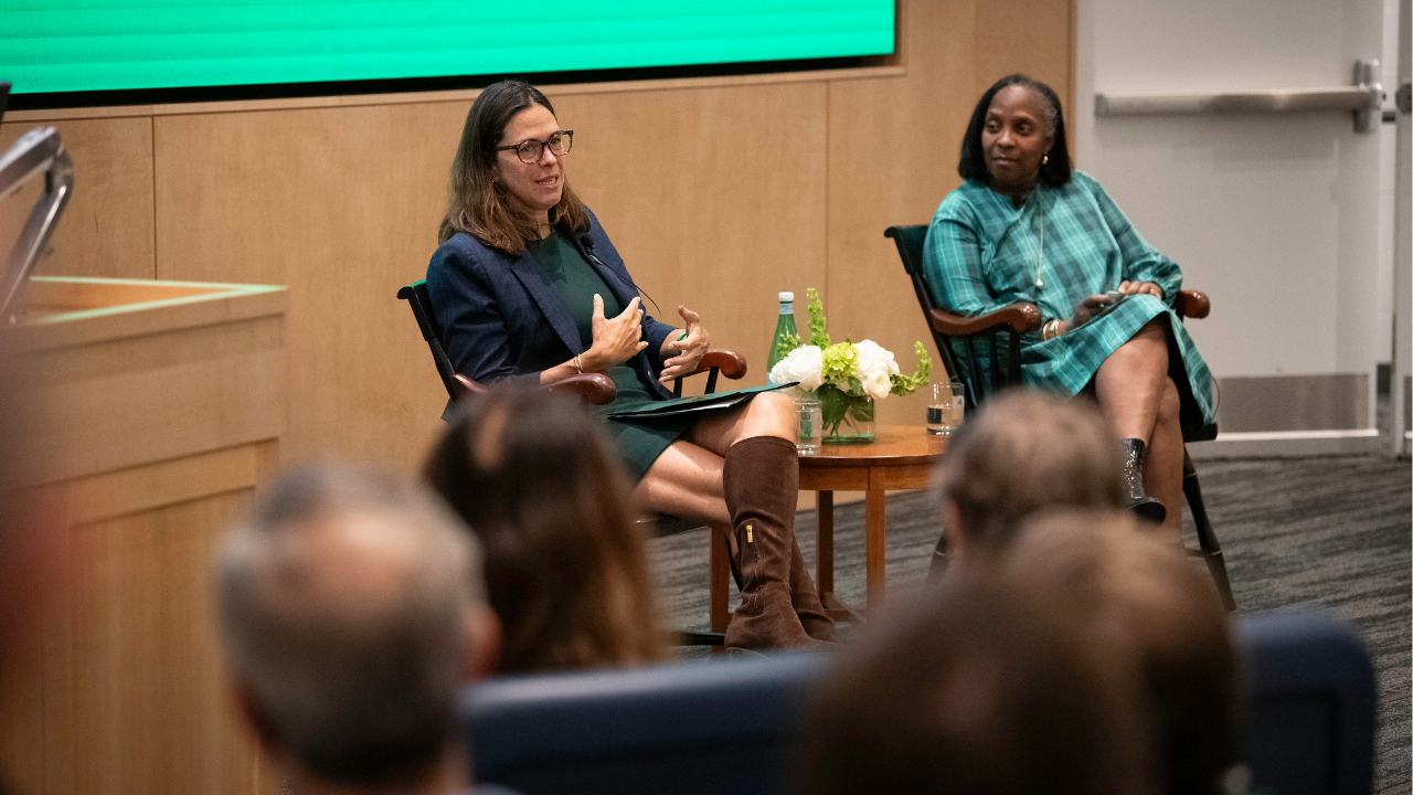 President Sian Leah Beilock ’76a and Trustee Odette Harris ’91 P’28 seated in conversation with families. 