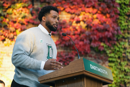 Man speaking at Dartmouth podium at dedication ceremony