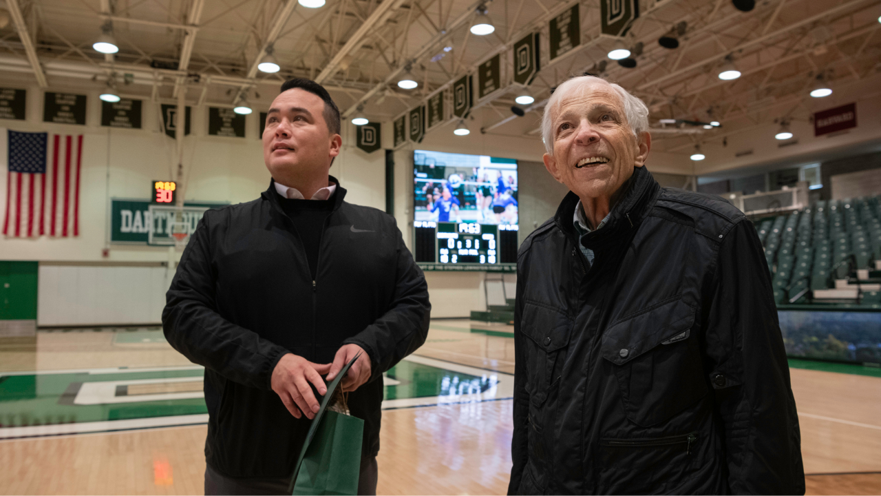 Stephen Lewinstein ’63 P’98 and Haldeman Family Director of Athletics and Recreation Mike Harrity share a moment on the gymnasium floor.