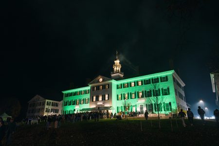 Dartmouth Hall lit up green.