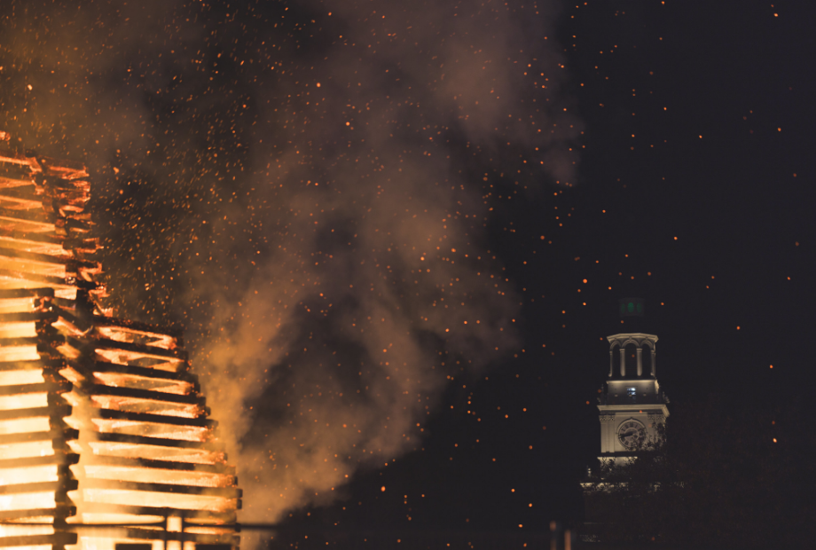 A closeup of the bonfire with baker tower in the background.