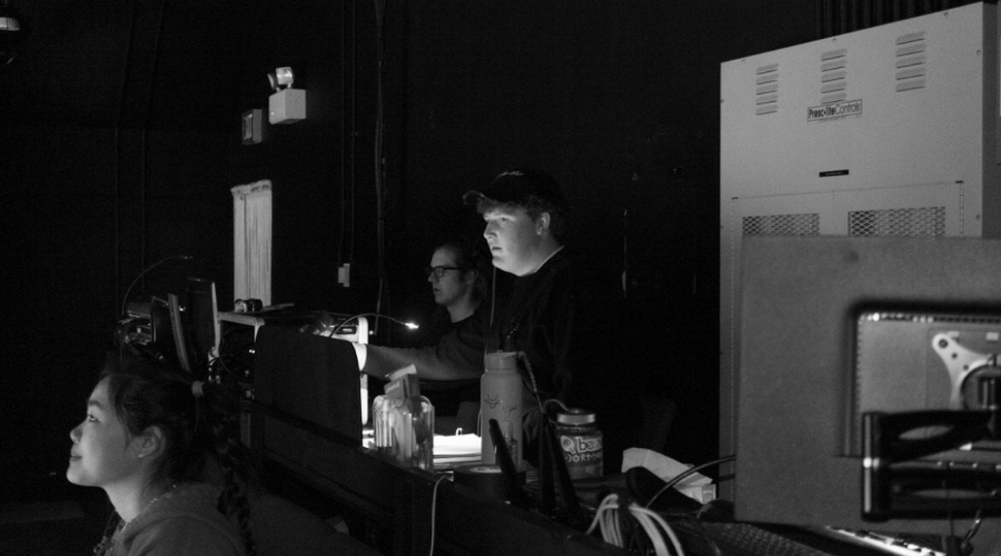 Matthew Jachim-Gallagher ’25 working on tech during a theater performance.