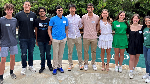 A group of volunteer from the Dartmouth Club of Dallas, posing for a photo