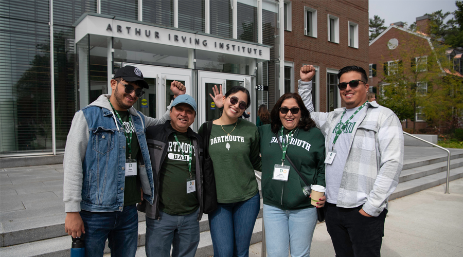 Family at Family Weekend 2024 posing in front of the Irving Institute