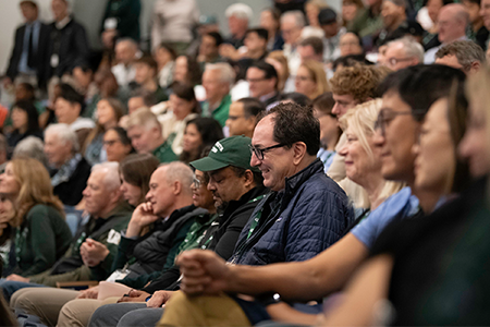 Crowd of families seated at presentation at Family Weekend