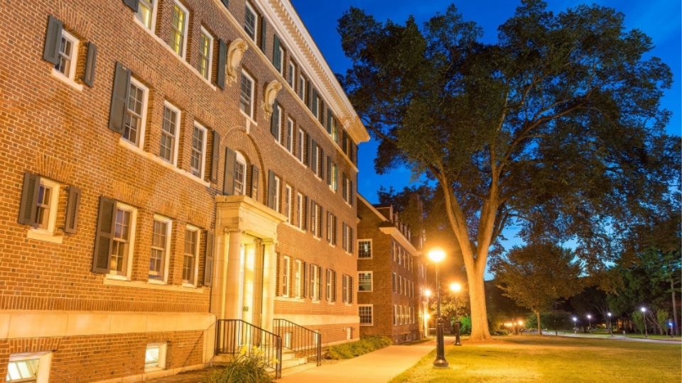 A residence hall at night.