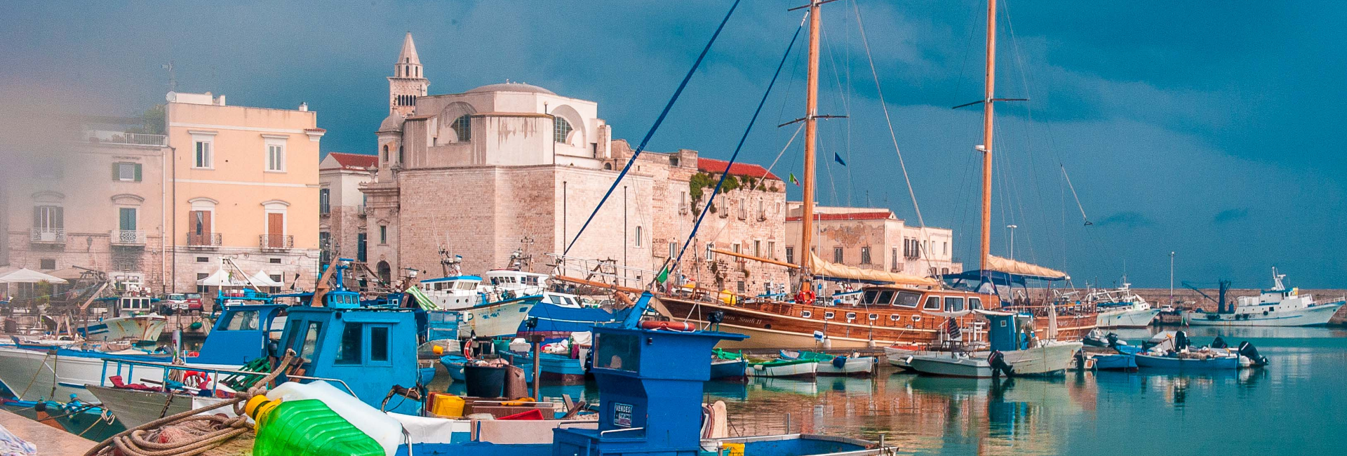 A photo of boats in a harbor in Puglia, Italy.