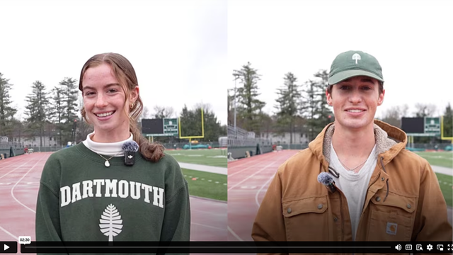A thumbnail image of two students standing outside on the athletics track.