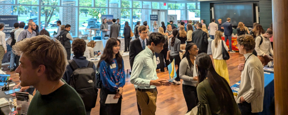 A photo of people at a networking event.