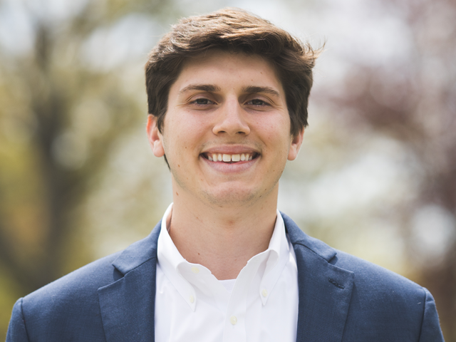 A headshot of Prescott Herzog