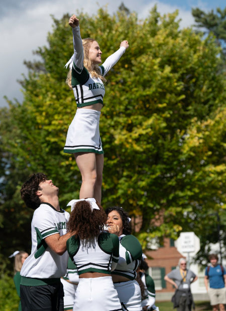 Cheerleaders doing a stunt.