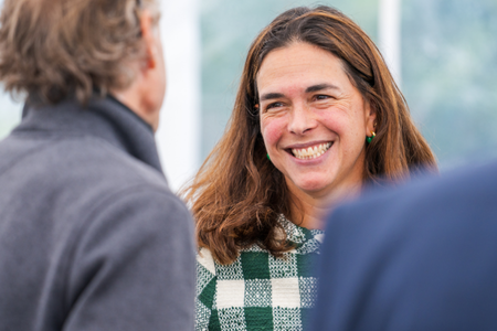 President Beilock smiling while talking to attendees. 