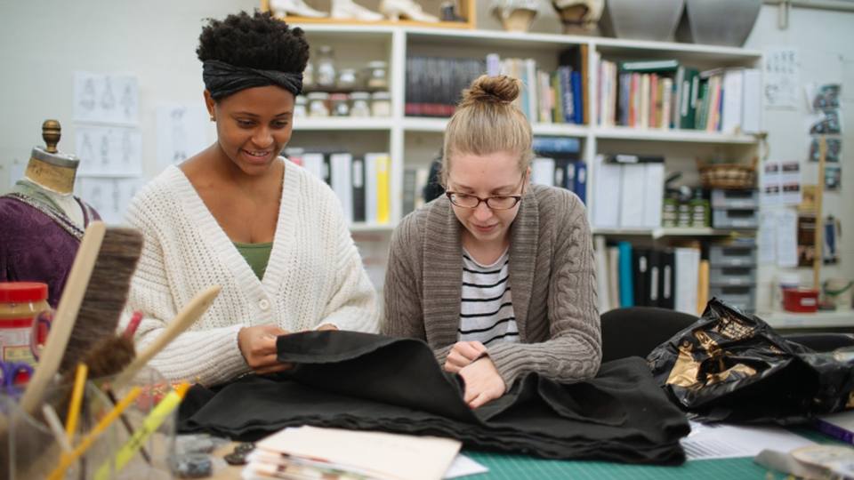 Celeste Jennings and Anna Winter working together on a garment for an upcoming performance