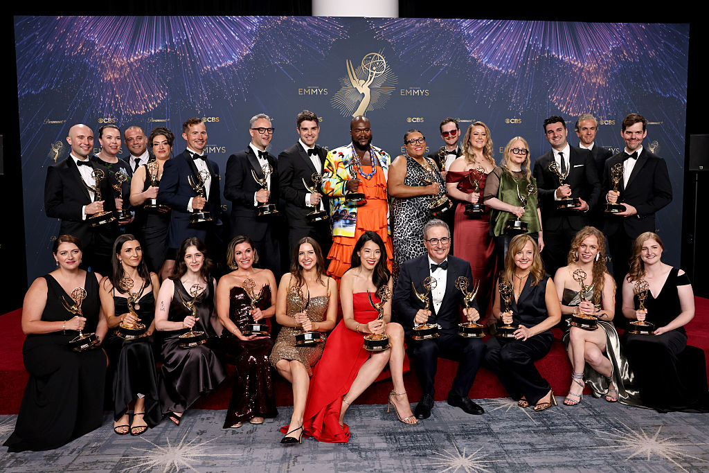 Members of the Last Week Tonight with John Oliver show posing with their statuettes at the 2025 Emmy's following their win