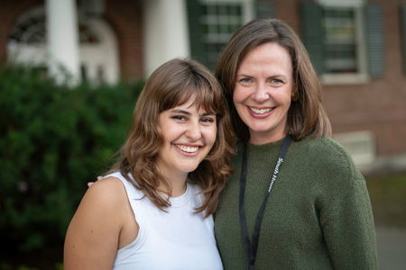 Two people posing and smiling.