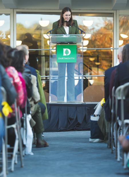 Presidet Beilock speaking at a podium outside the new Hop