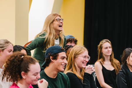 Connie laughing in a workshop with students