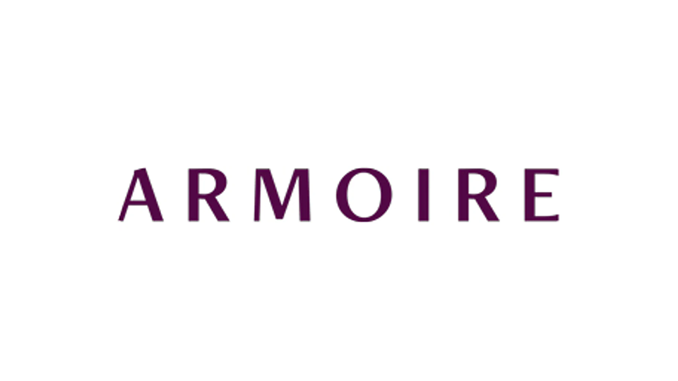 Armoire, all caps purple letters formulating the company logo.