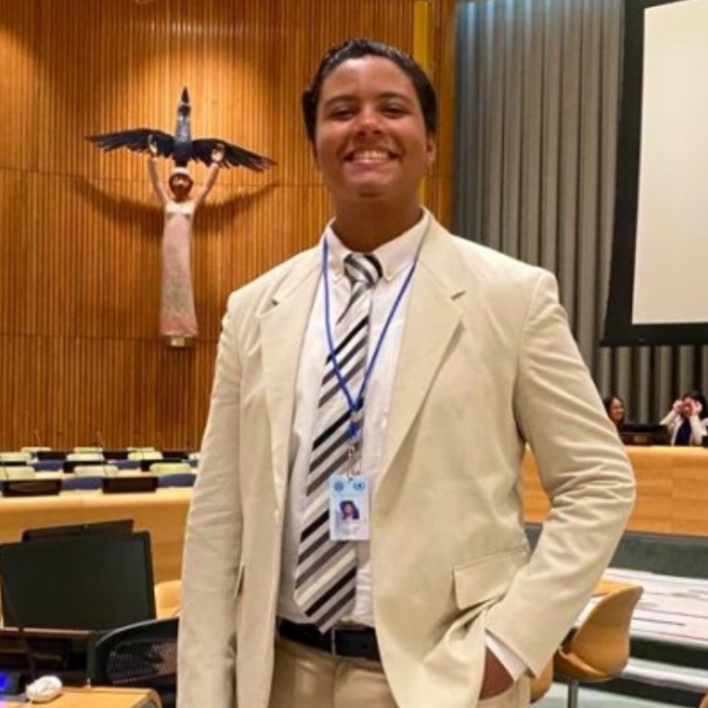 Angel posing in a suit. 