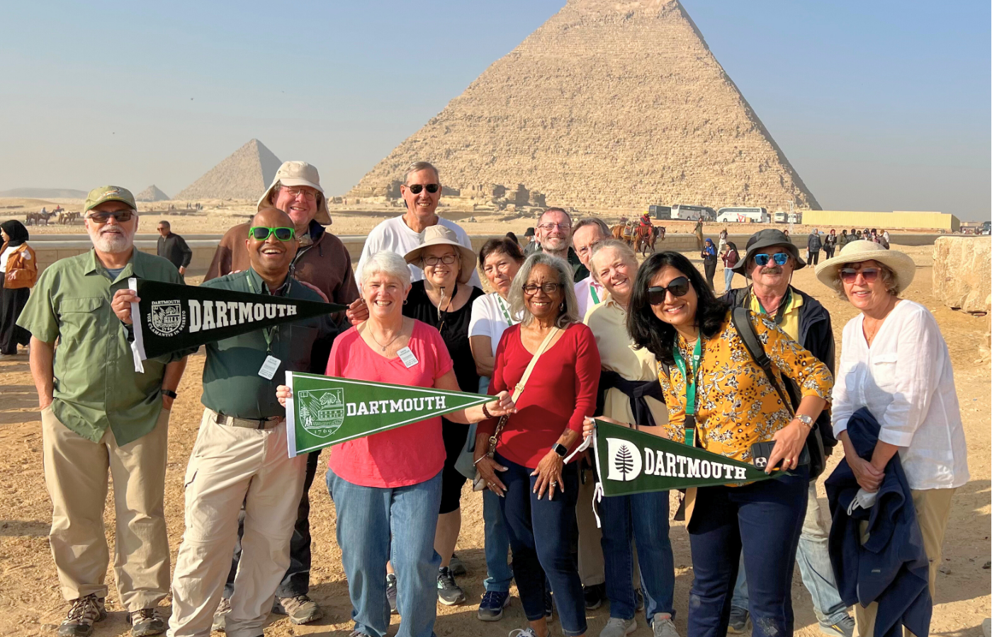 Professor Swayne poses with a group in front of the pyramids.