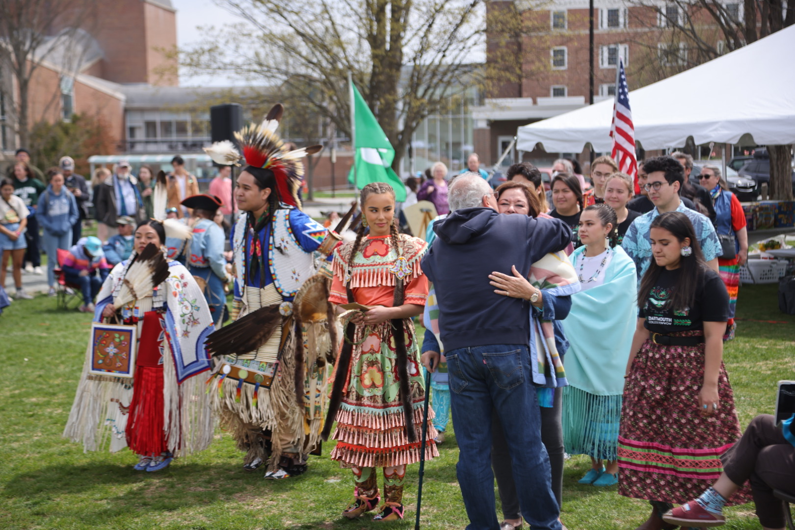 N. Bruce Duthu greets professor Vera Palmer as she is honored with a dance at the powwow 