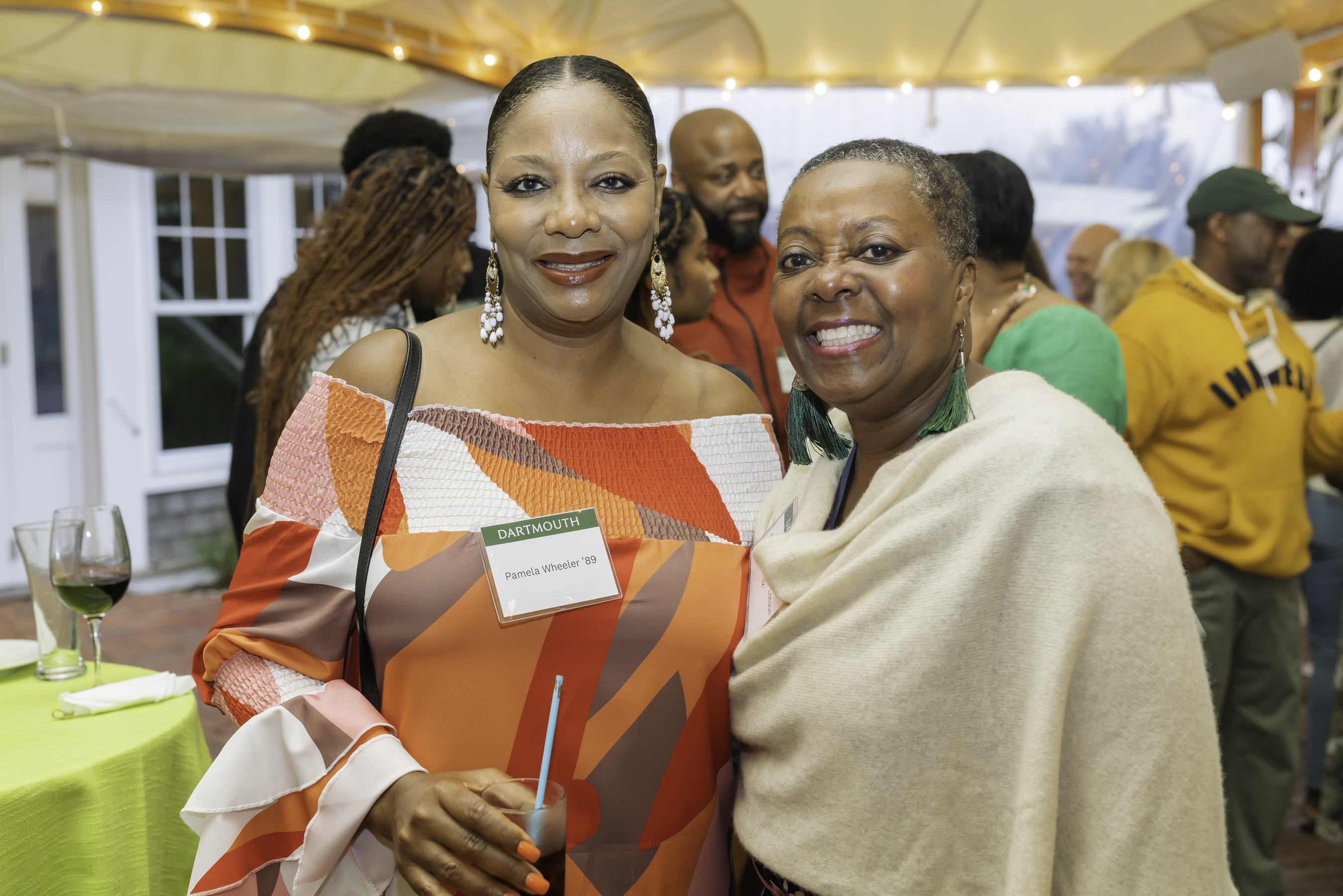 Two women attendees posing and smiling